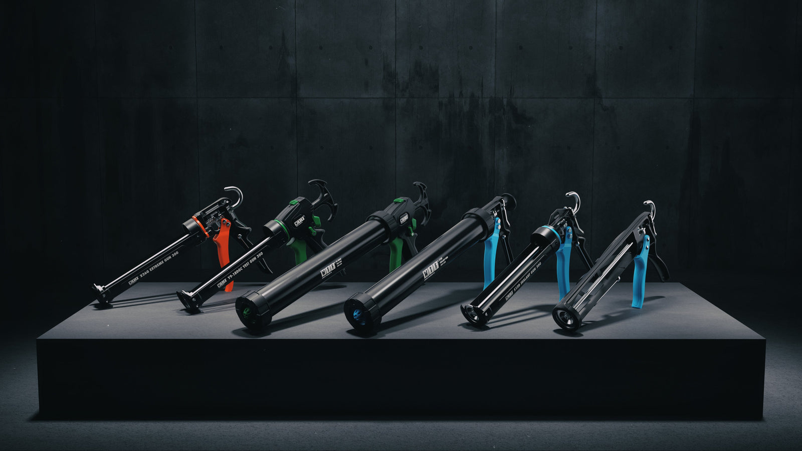 Set of caulking guns on a dark platform with a black tiled wall background